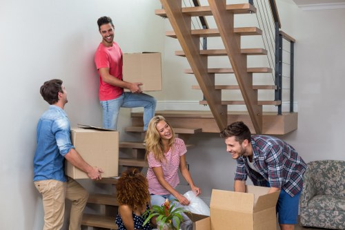 Local team removing bulky furniture with access challenges