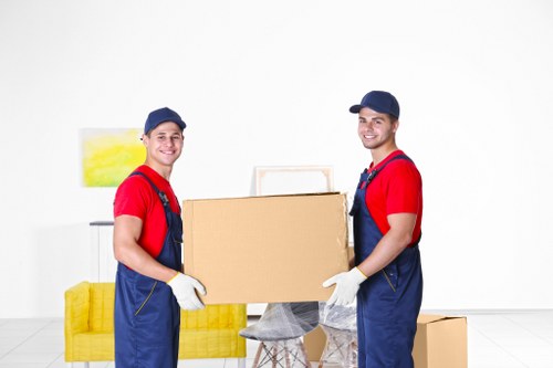 Movers loading household items into a truck in Switzerland