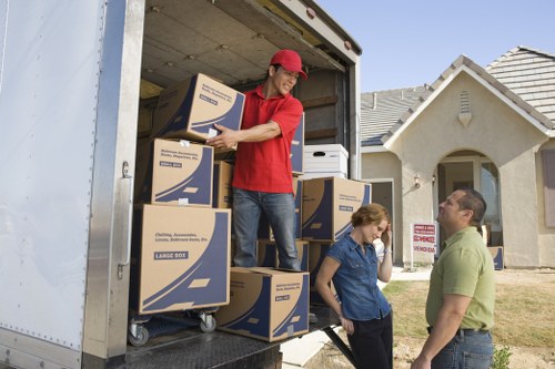 Removal team assessing a small apartment move in Switzerland