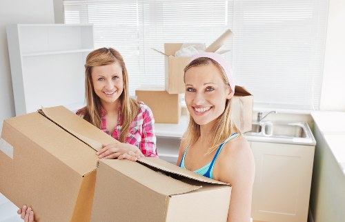 Professional movers handling household items in a Swiss home move