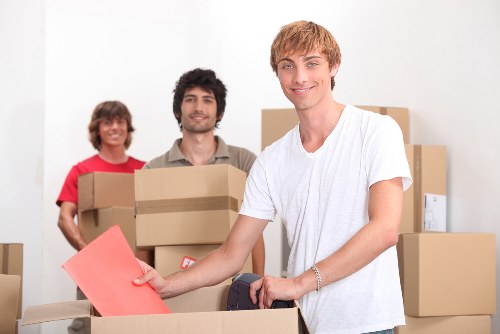 Movers packing furniture and boxes for a local relocation in Switzerland